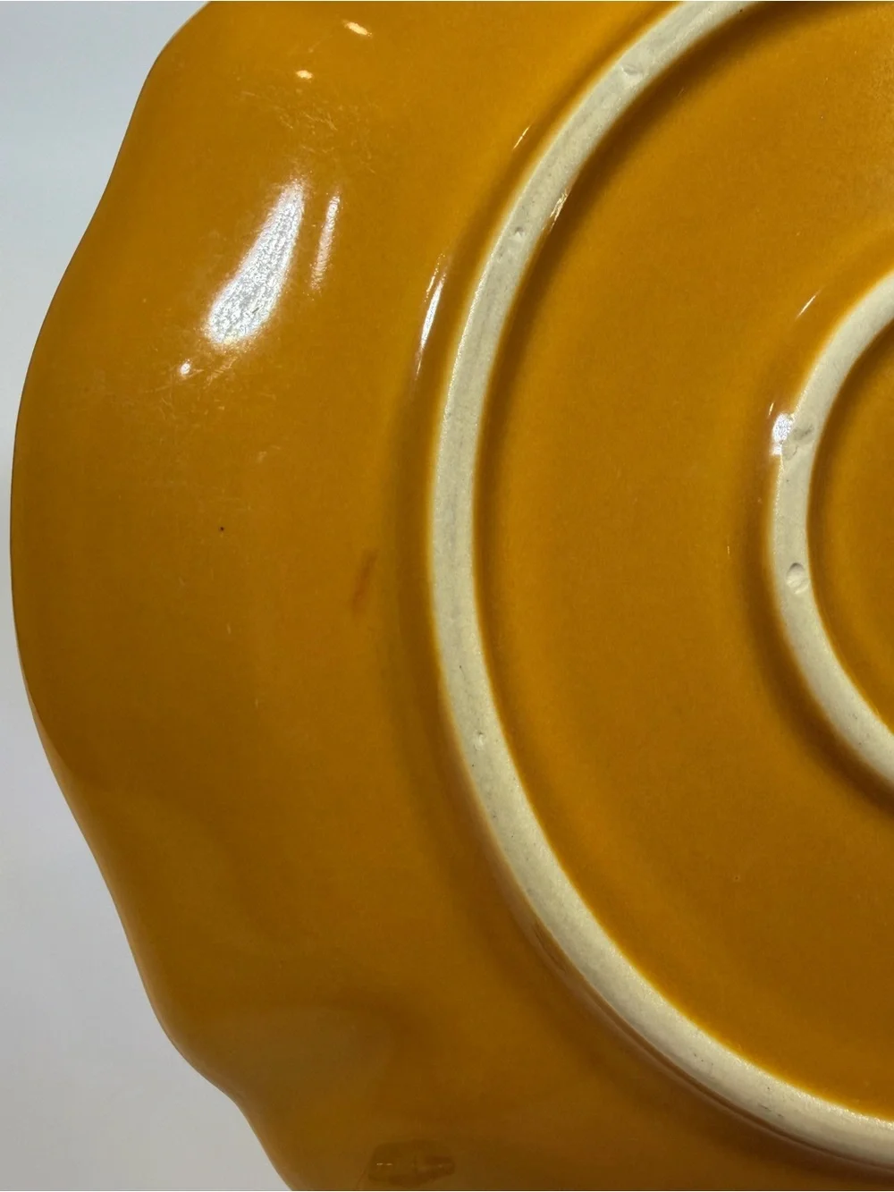 Crate&Barrel Scalloped Ceramic Plate in Mustard